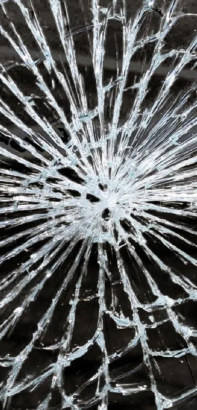 Broken glass pattern on a dark background, creating an edgy phone wallpaper.