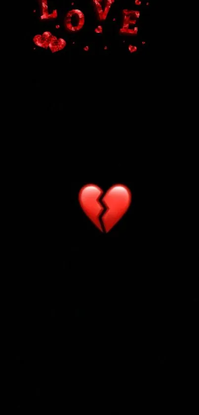 Glowing broken red heart on black background wallpaper.