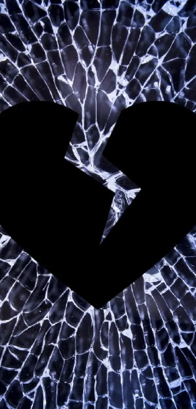 Broken heart silhouette on shattered glass background in dark tones.