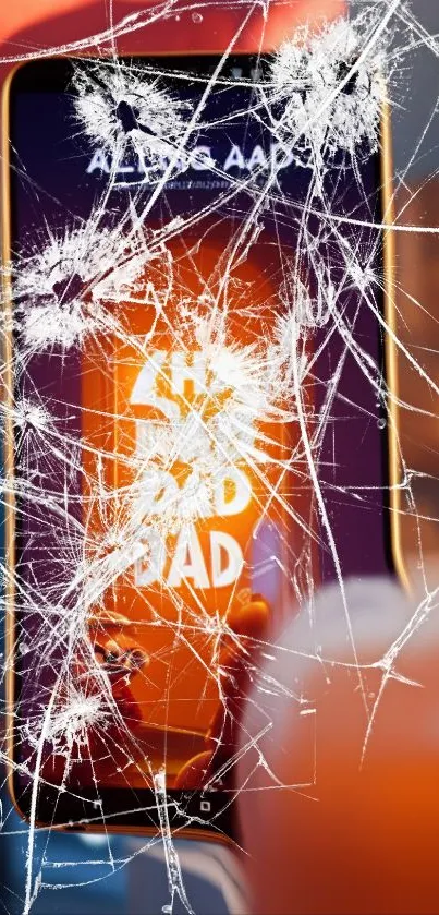 Shattered smartphone screen with bold orange and white hues.