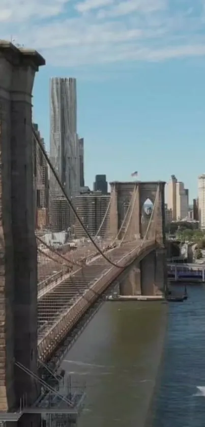 Brooklyn Bridge under blue sky with cityscape in background.