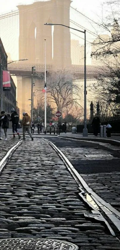 Brooklyn Bridge with cobblestone path and skyline in the background.