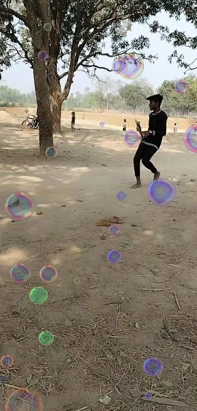 Person dancing with bubbles under trees in a natural setting.