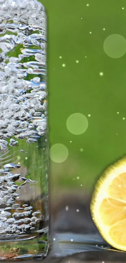 Glass of sparkling water with lemon slice on green background.