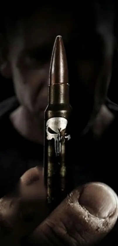 Close-up of a bullet with a skull design in a dark themed wallpaper.