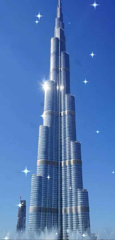 Burj Khalifa against a clear blue sky with fountains.