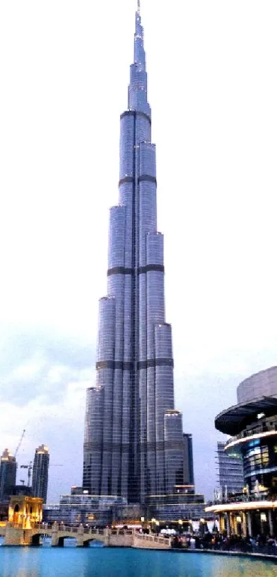 Burj Khalifa reflected in water at twilight, showcasing Dubai's skyline.