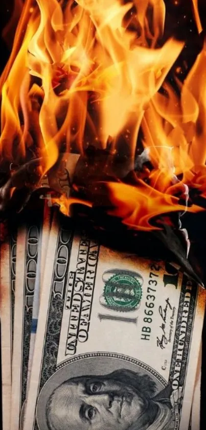 Burning dollar bills with flames on a dark background.