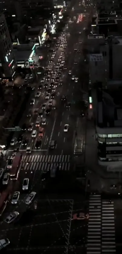 Vibrant city street at night with heavy traffic.