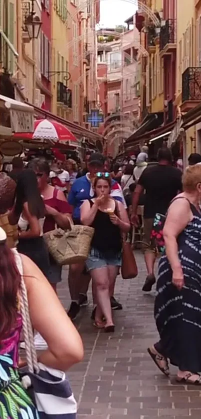 Vibrant European street filled with shoppers and colorful buildings.