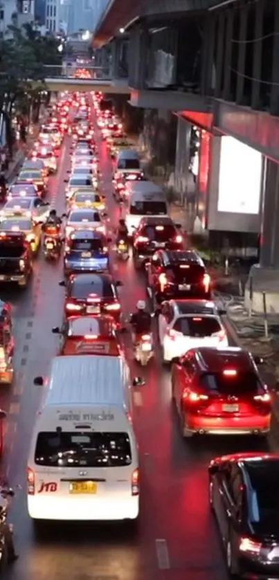 Vibrant city street with heavy traffic and illuminated red car lights.