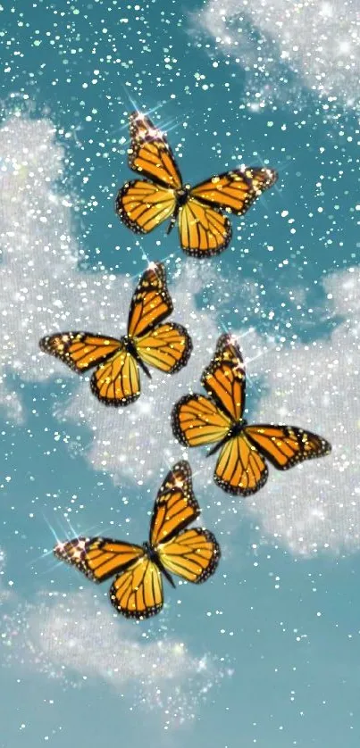 Four butterflies fluttering in a sparkling blue sky with clouds.