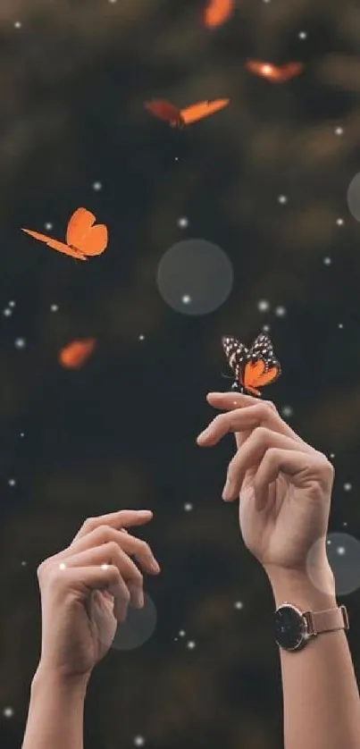 Hands reaching towards fluttering orange butterflies on a dark background.