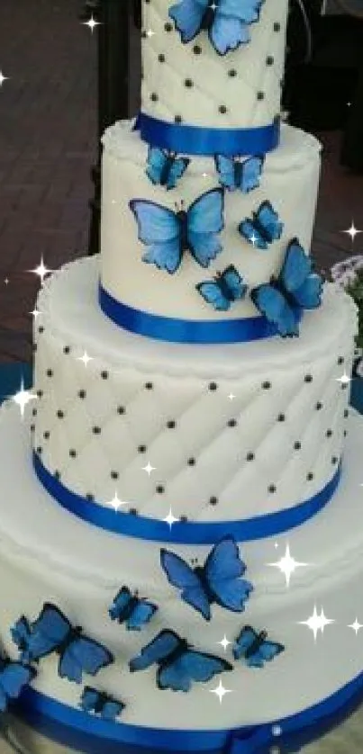 White cake with blue butterfly decor, perfect for weddings.