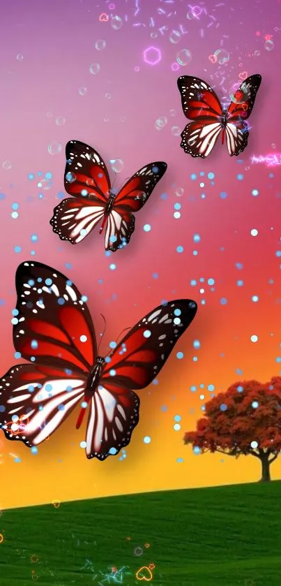 Butterflies and tree with vibrant sunset sky.