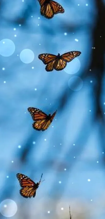 Monarch butterflies flying in clear blue sky.