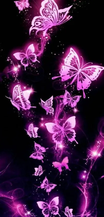 Neon pink butterflies glowing on a dark background.