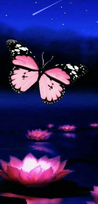 Pink butterfly over water lilies at night with a deep blue background.