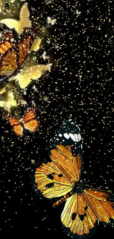 Vibrant orange butterflies sparkle against a black background with gold particles.