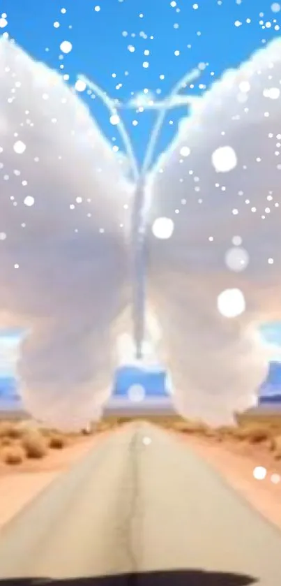 Butterfly-shaped cloud over a desert road with a bright blue sky.