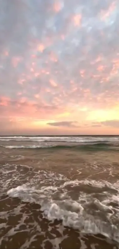 A peaceful beach sunset with gentle waves and a colorful cloudy sky.