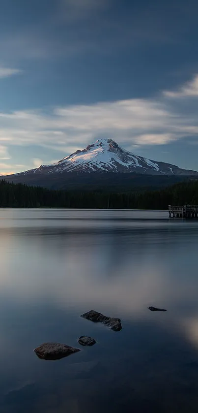 Serene mountain and lake view at dusk with calming water reflections.