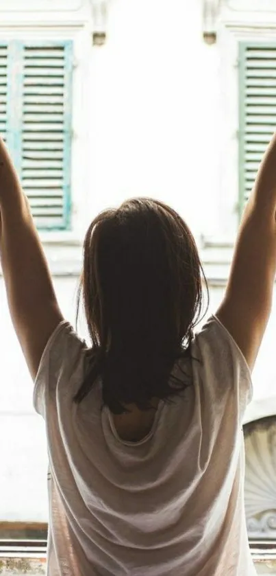 Person enjoying a serene morning by the window in a peaceful setting.