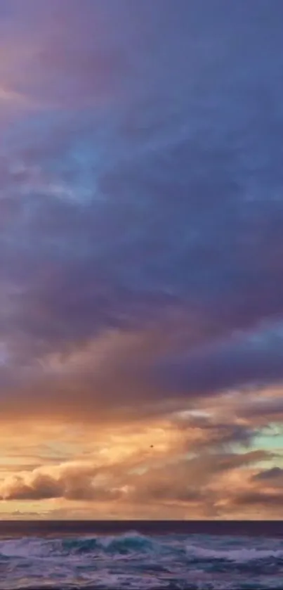 Vivid ocean sunset with dramatic clouds and calming waves.