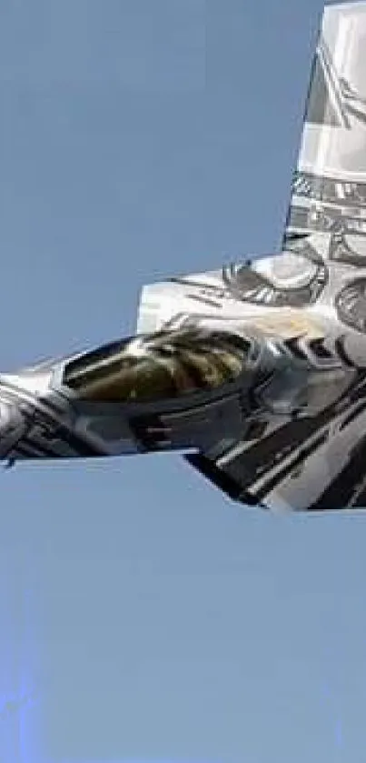 A modern fighter jet with camouflage design flying in a clear blue sky.