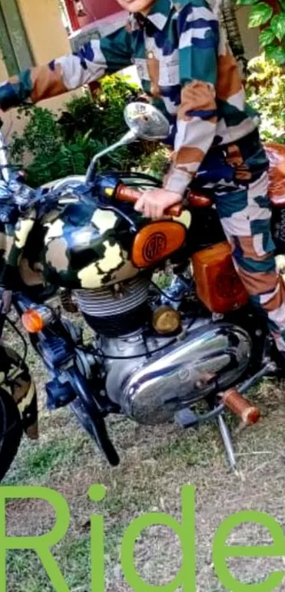 Camouflage motorcycle with rider in matching gear, parked outdoors.