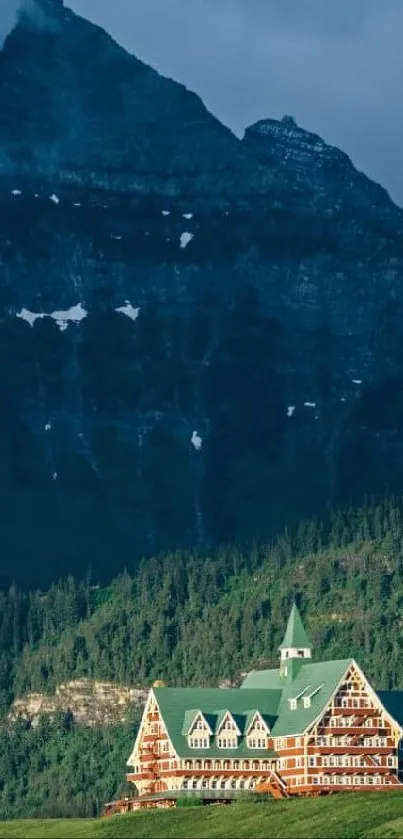 Scenic view of a Canadian Rockies mountain with a lodge in the foreground.