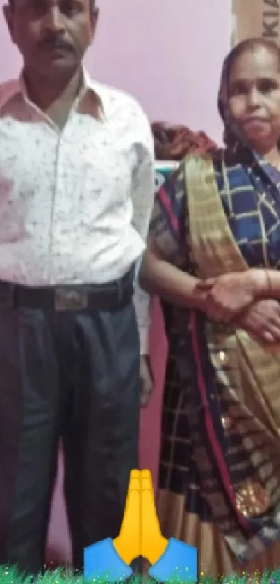 Candid photo of a couple in traditional attire against a vibrant backdrop.