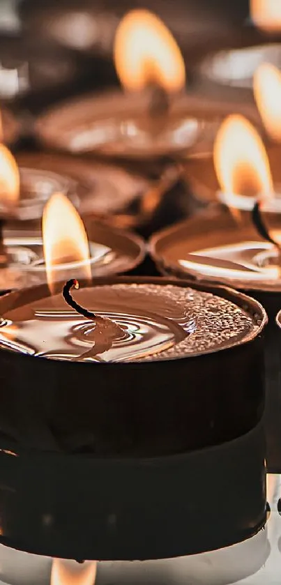 Serene amber candlelight creates a relaxing mobile wallpaper.