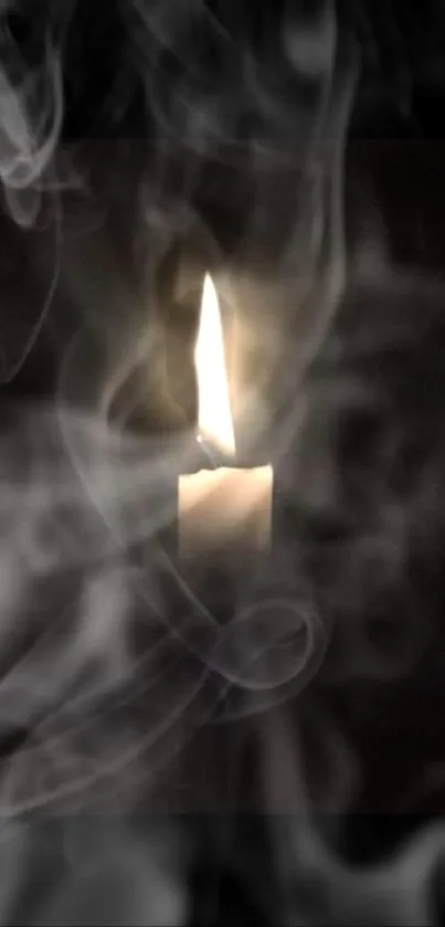 Candle with soft smoke swirl on dark background