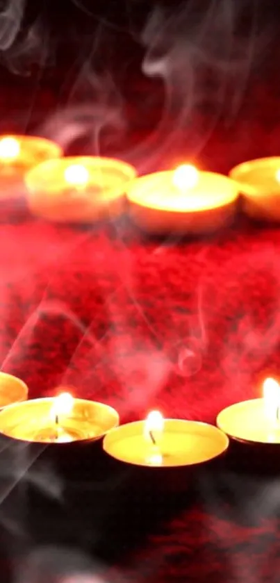 Glowing candles on rich red textured background with soft, smoky ambiance.