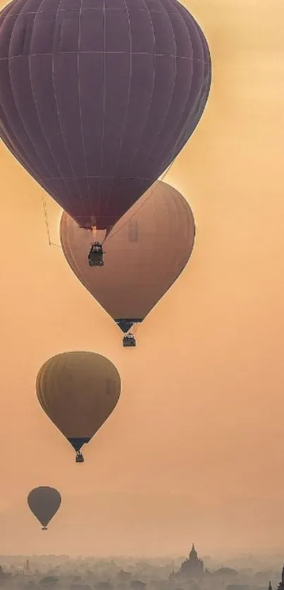 Cappadocia hot air balloons at sunrise over ancient landscape.