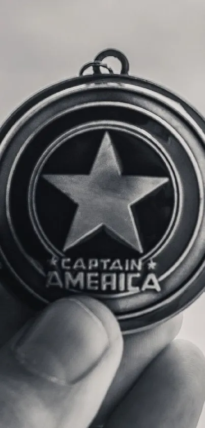 Captain America emblem in monochrome design, star in center.