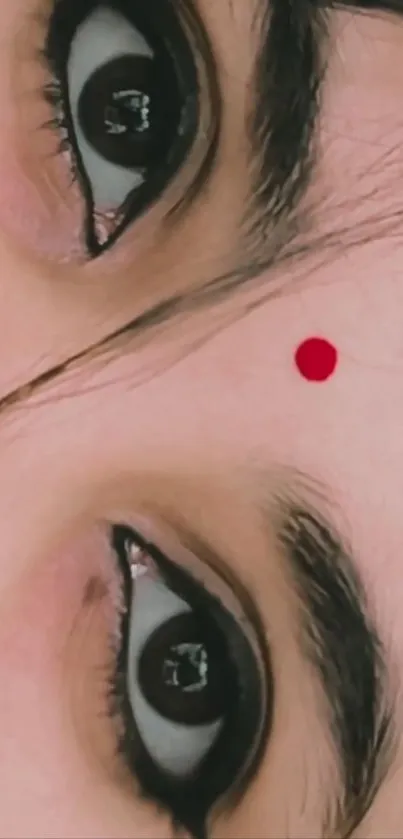 Close-up of eyes with red bindi, beige tones.