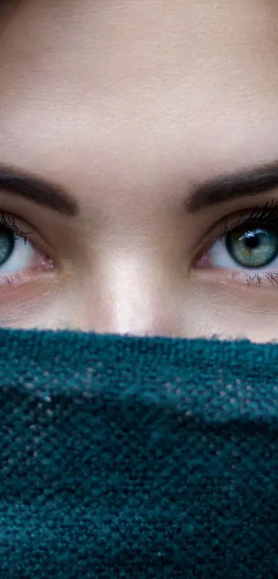 Close-up of captivating teal-covered eyes.