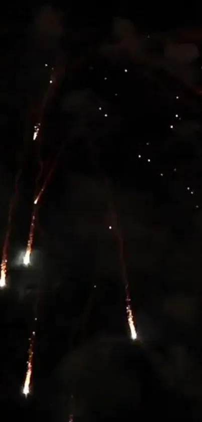 Fireworks streak across a dark sky, illuminating the night with festive brilliance.