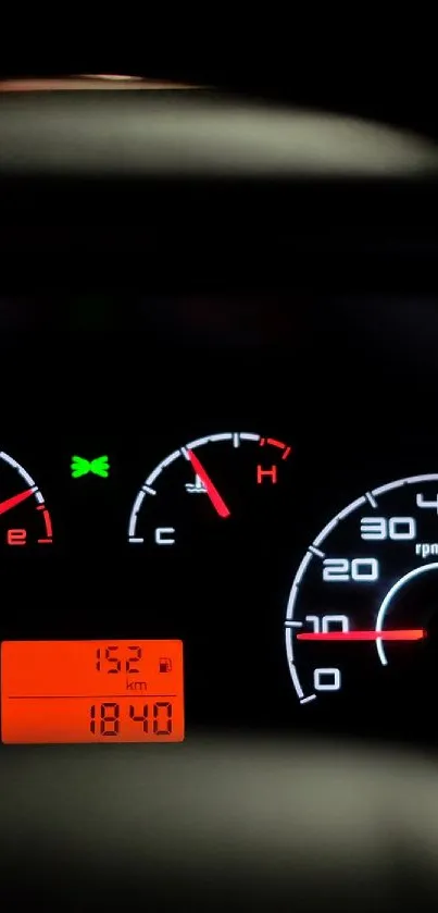Vibrant car dashboard speedometer at night.
