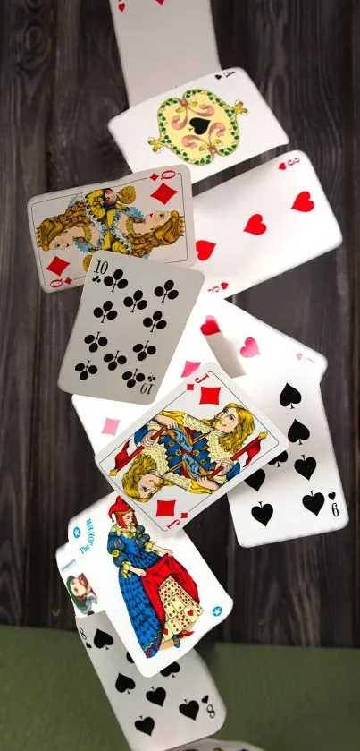 Dynamic cascade of playing cards on wood background.