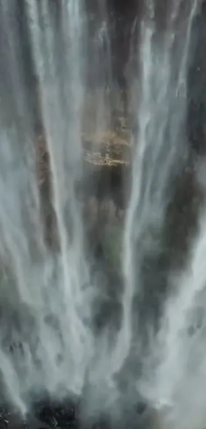 Cascading waterfall in a serene natural setting.