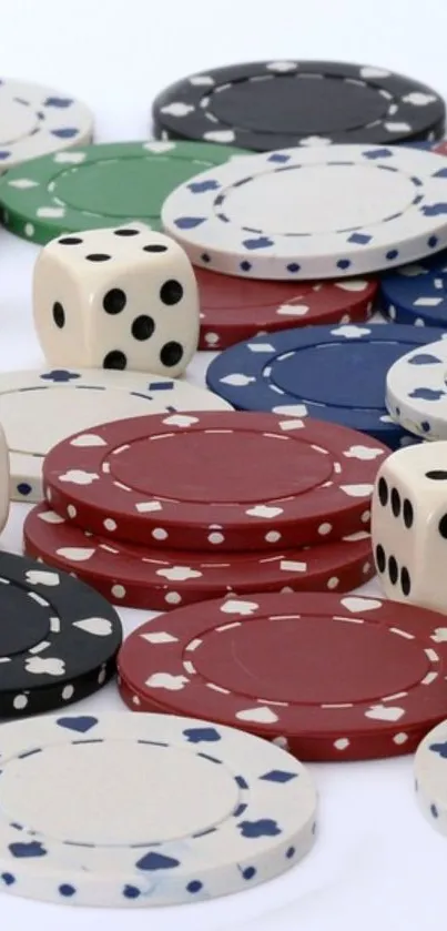 Assortment of colorful poker chips and dice on a white background.