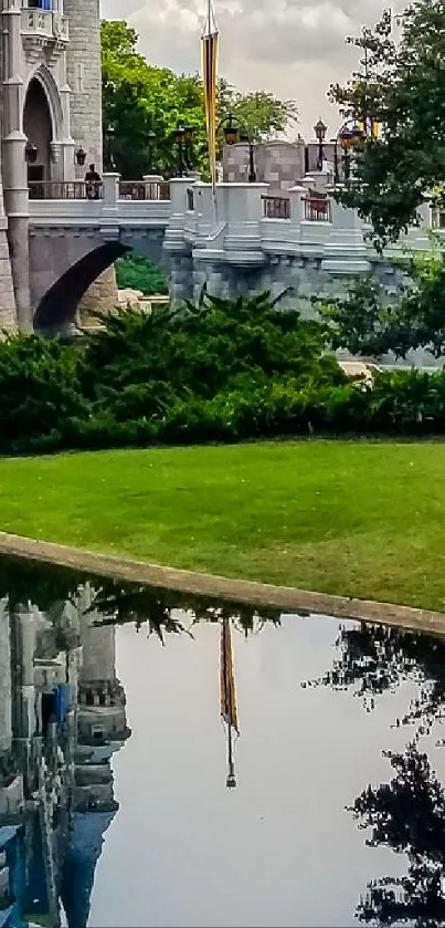 Castle reflected in a tranquil pond amid lush greenery.