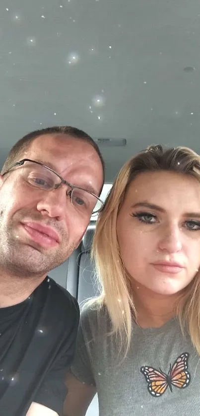 Casual selfie of two people in a car.