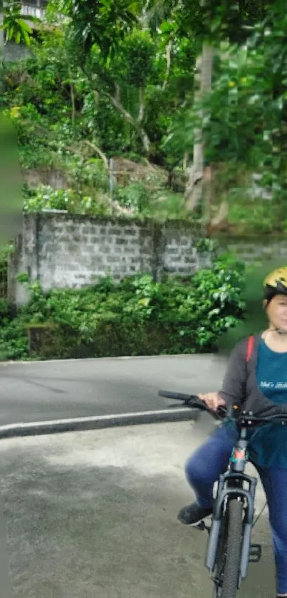 Cyclist on rural road surrounded by greenery.