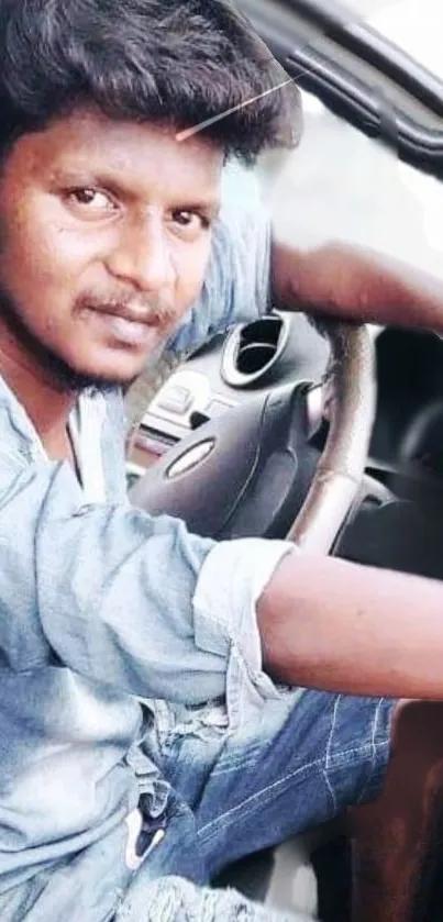 Casual portrait in denim seated in a car.