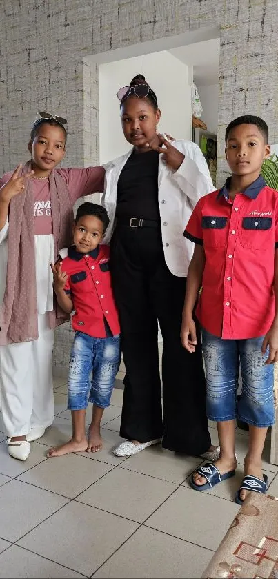 Family in casual attire posing indoors with bright smiles.