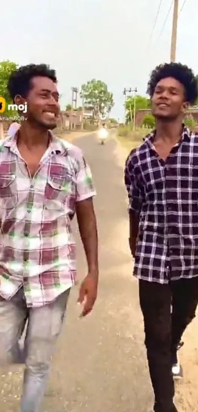 Two friends walking down a rural road.